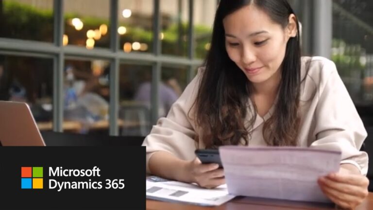 The woman is sitting and reading a document